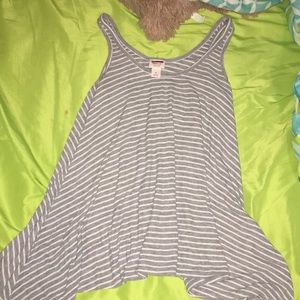 A striped , open tank top shirt .